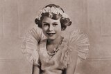 A black and white photo of Queen Elizabeth II as a child.