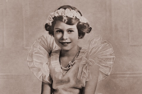 A black and white photo of Queen Elizabeth II as a child.