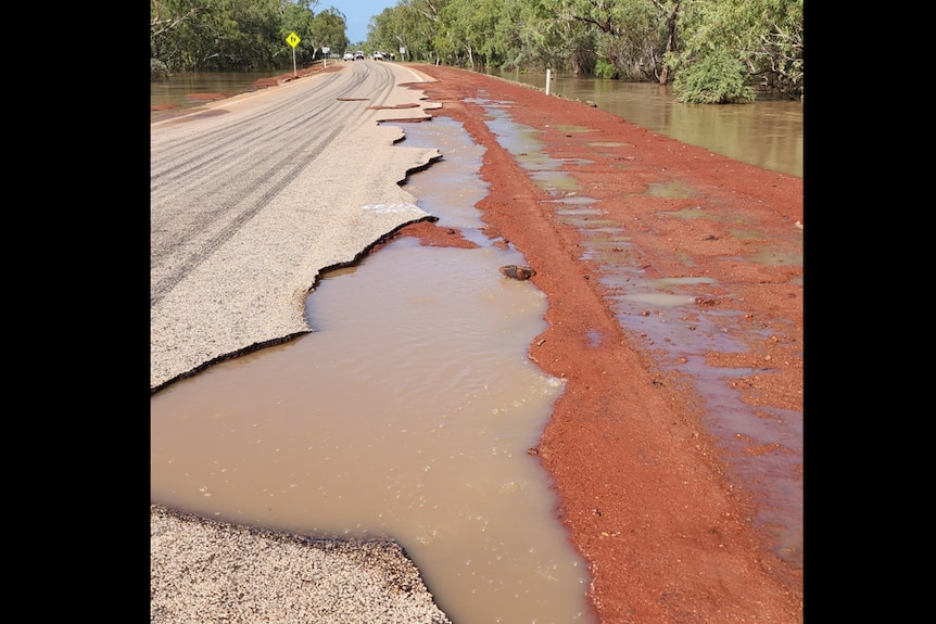 Puddles and corroded road in a flood zone