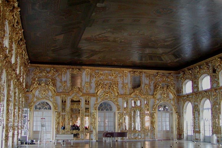 an interior shot of a ballroom decorated in gold