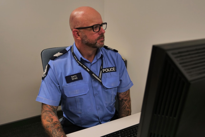 a police officer at a desk