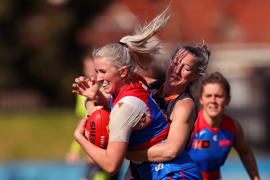 Gabby Newton is tackled.