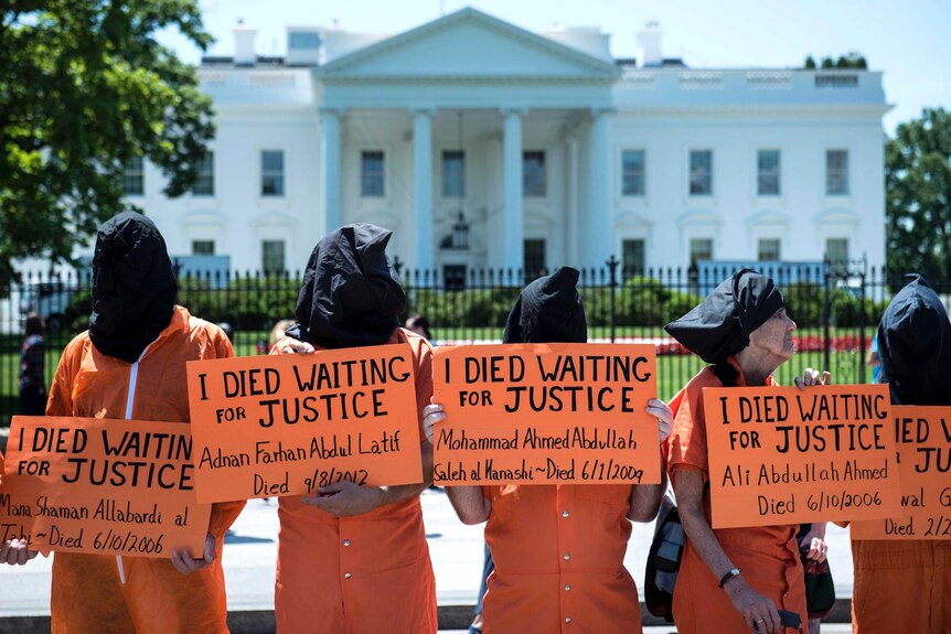 Activists protest outside the White House.