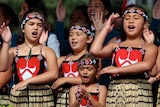 Four girls do a traditional Maori dance