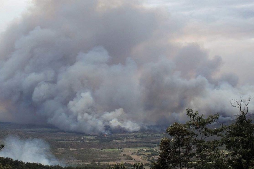 Massive smoke clouds fill the air from bushfires in central Queensland