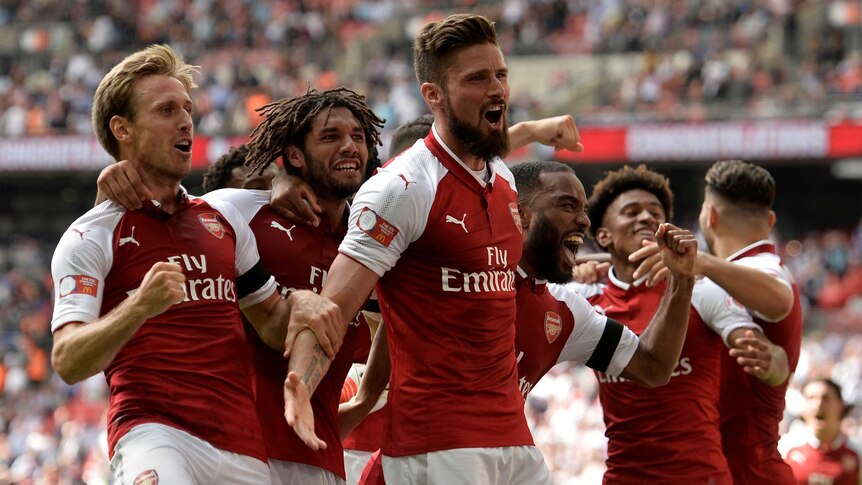 Giroud and Arsenal players celebrate