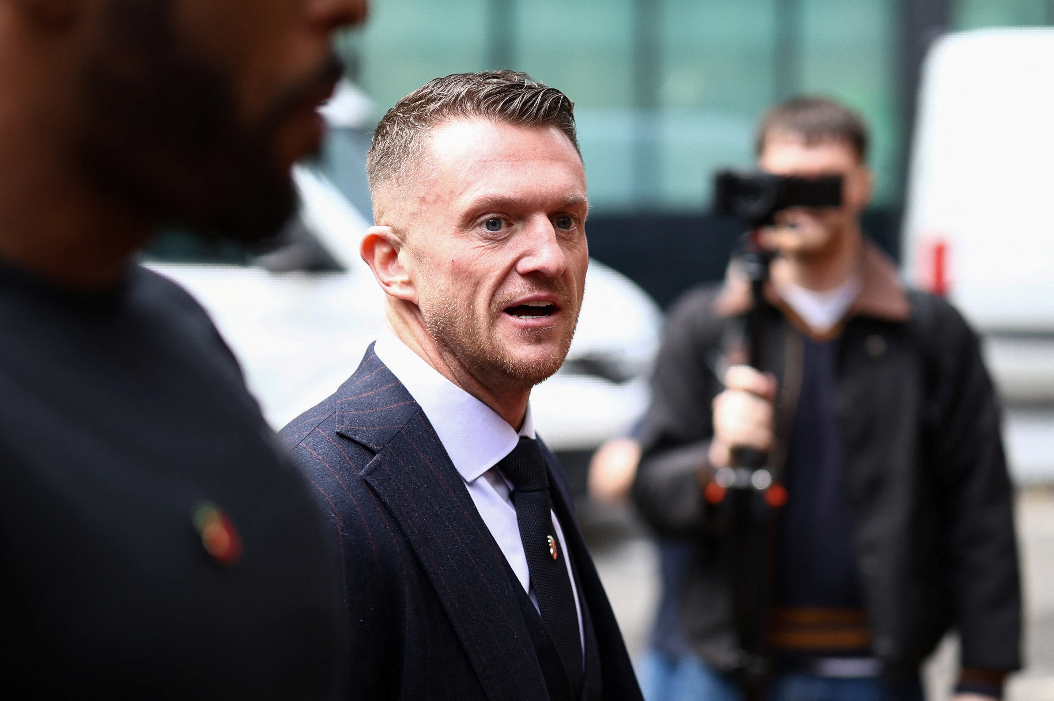 Far-right activist Tommy Robinson found guilty of harassing journalists