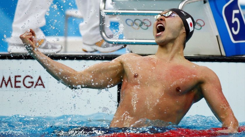 Kosuke Kitajima celebrates breaking the world record