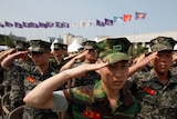 South Korean soldiers participate in a ceremony marking the 62nd anniversary of the outbreak of the 1950-53 Korean War