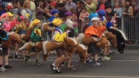 Children dressed in horse suits at the Melbourne Cup parade