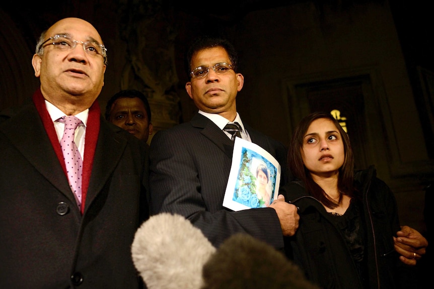 Keith Vaz speaks to media alongside Lisha and Ben Barboza, with a picture of Jacintha Saldanha.