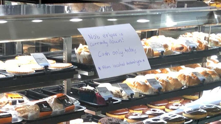 A sign at an Adelaide bakery says EFTPOS is not available due to a NAB outage on May 26, 2018.