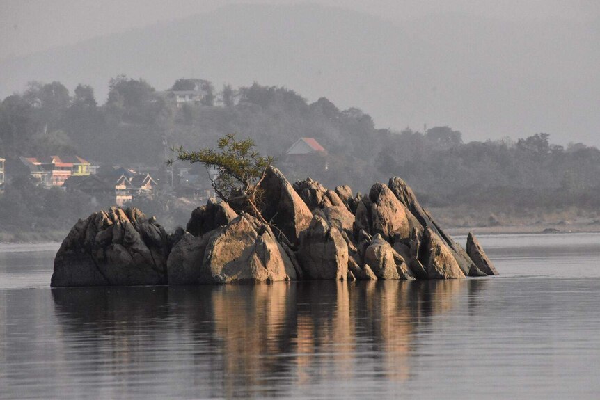 Rocks can be seen up to two metres above the water level in the Mekong River.