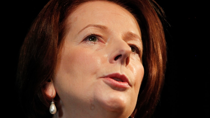 Julia Gillard says the NDIS will be brought in a year sooner than recommended (file photo)