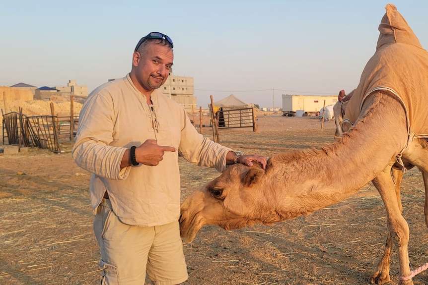 A man with a camel.