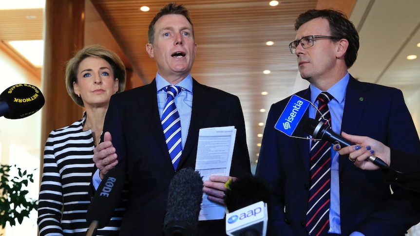 Government ministers Michaelia Cash, Christian Porter and Alan Tudge speak to the media in Canberra.