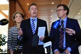 Government ministers Michaelia Cash, Christian Porter and Alan Tudge speak to the media in Canberra.