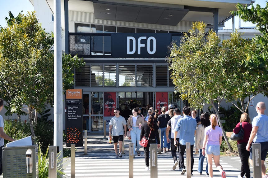 Shoppers walking outside DFO.