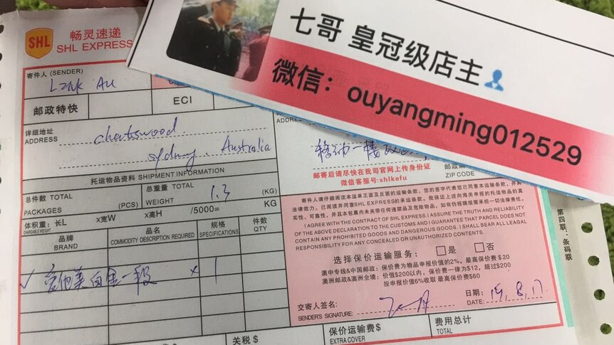 An order form showing what Qi Ge is sending to a customer and another slip of paper with the name of his WeChat store.