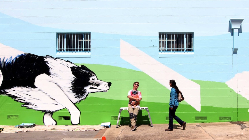 Artist Jimmy Dodd with Bordertown street mural