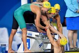 Bronte Campbell of Australia (pool) celebrates with her team mates.