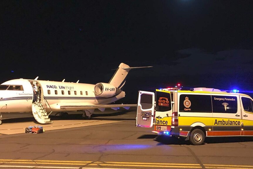 The RACQ LifeFlight plan at the Moranbah airport with police and ambulance.