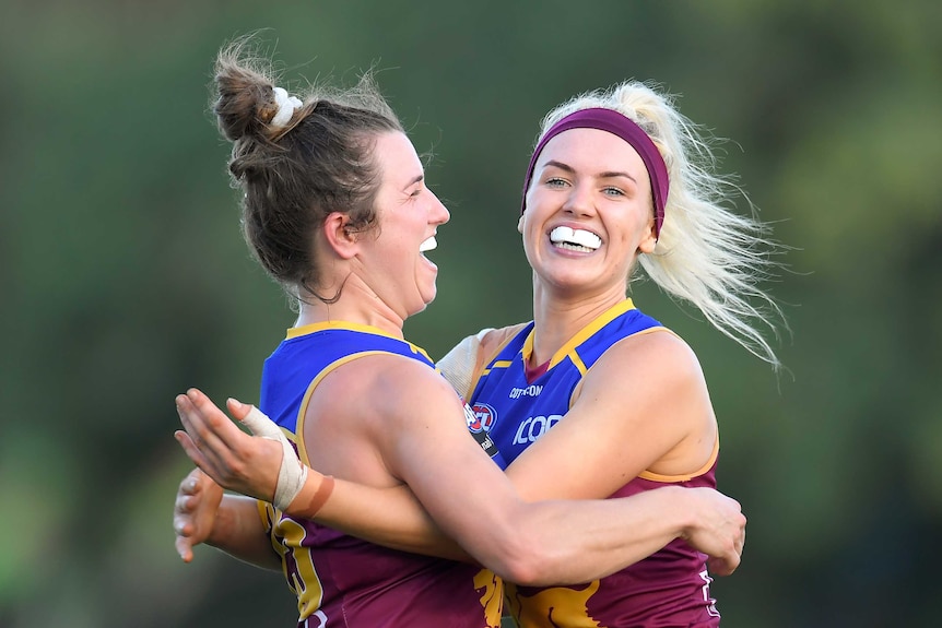 Catherine Svarc and Orla O'Dwyer after kicking a goal for the Brisbane Lions against the GWS Giants in Brisbane.