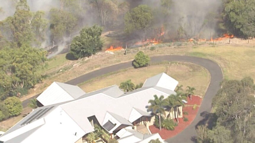 As fires approached properties in The Gap, residents were seen trying to extinguish the flames.