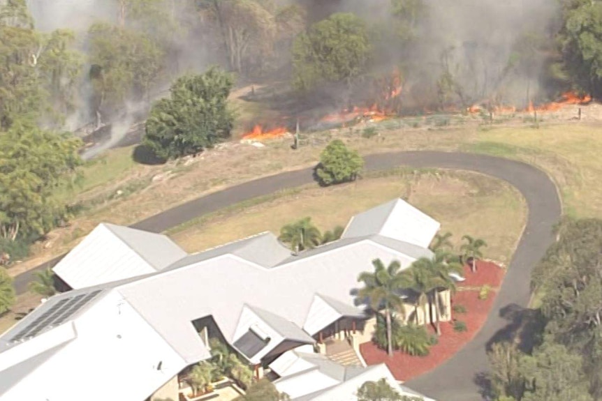 As fires approached properties in The Gap, residents were seen trying to extinguish the flames.