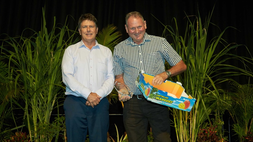 David Hoseason-Smith (right), receiving an innovation award from NT Farmers' president Simon Smith.