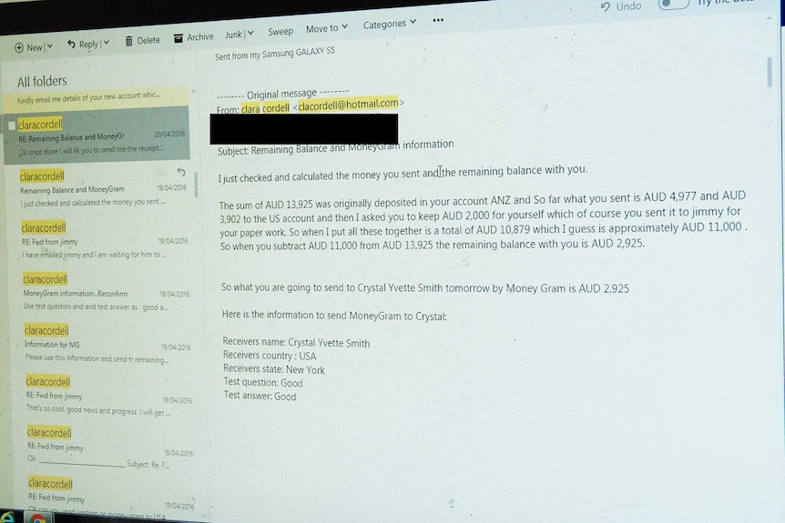 Emails in 2016 about money laundering scam displayed on a computer screen.