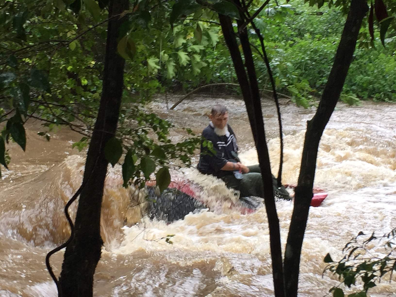 Dramatic rescue from floodwater as heavy rain closes major roads in ...
