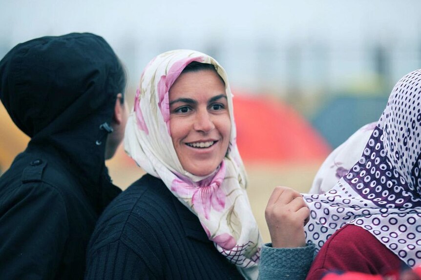 Turkish woman smiles in queue