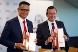 Ben Wyatt and Mark McGowan wearing broad grins and holding budget documents.