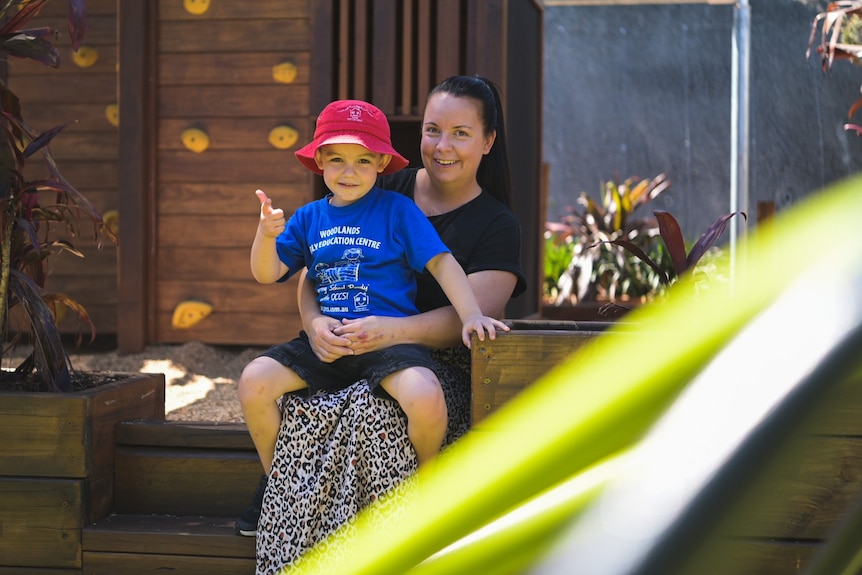 Alli Kemp with her son Hudson, 4, sitting on her lap at the day care centre.