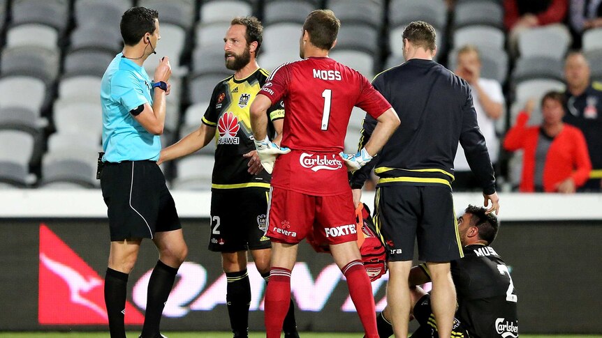 Wellington players confront referee after Manny Muscat (#2) is headbutted against Central Coast