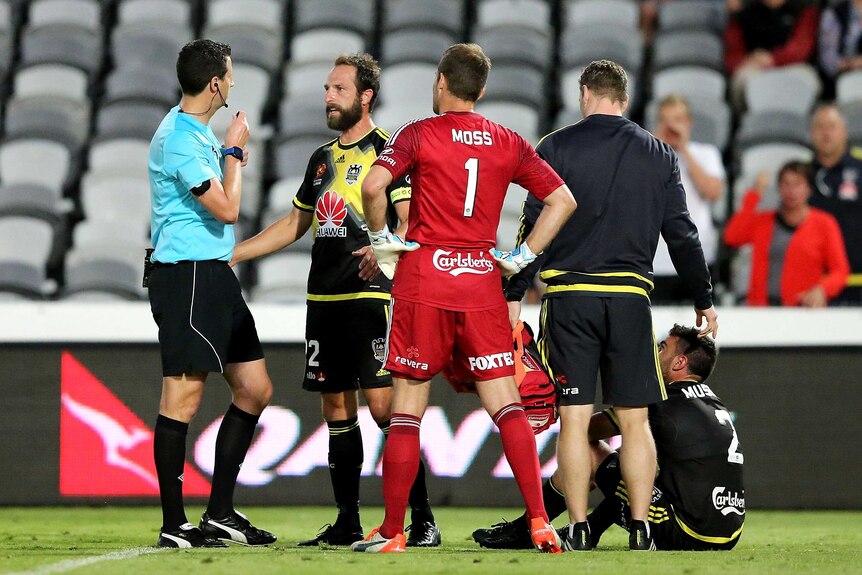 Wellington Phoenix players remonstrate with the referee after an altercation against Central Coast