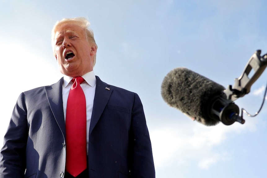 US President Donald Trump speaks to reporters