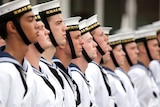 Navy cadets stand at attention