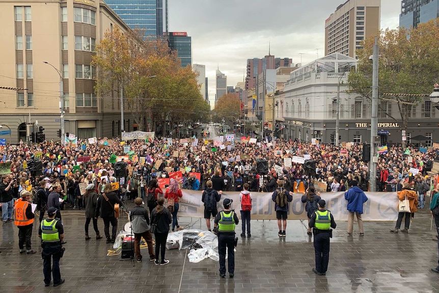 Hundreds of people gathered outside the Victorian Parliament.