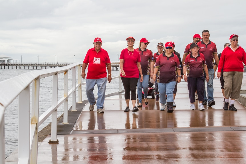 Walkers look out over the water at Moreton Bay.