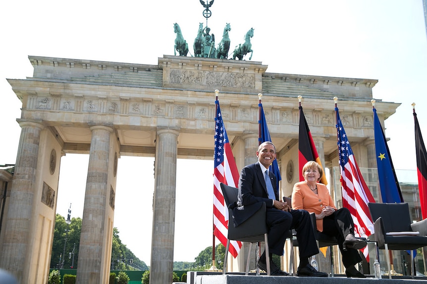 Angela Merkel and Barack Obama together on stage at the Brandenberg Gate in Berlin.