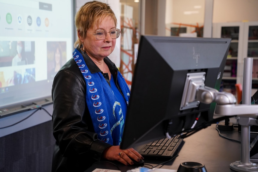 Cindy Smith working at her computer.