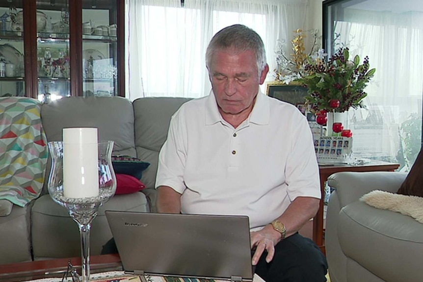 Alexander Ivanov sits as he looks at a laptop computer.