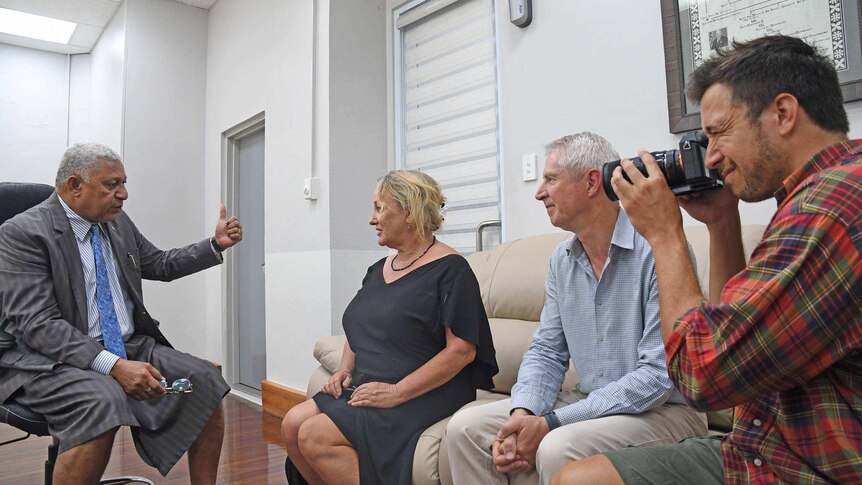 Fiji's Prime Minister Frank Bainimarama speaks with New Zealand journalists Melanie Reid, Mark Jennings and Hayden Aull.
