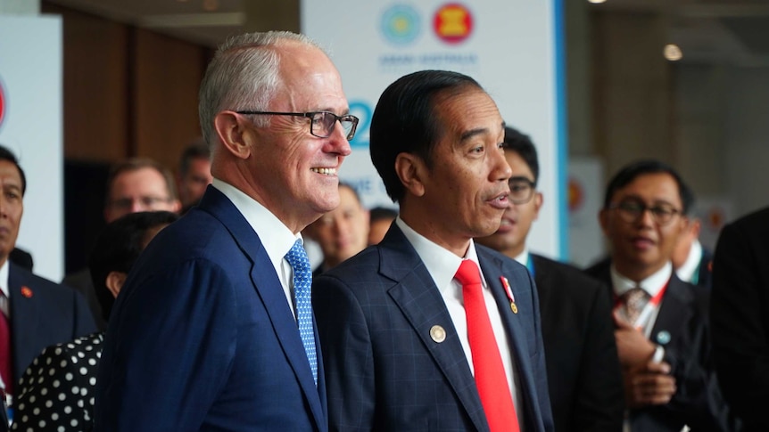 Malcolm Turnbull stands with Joko Widodo