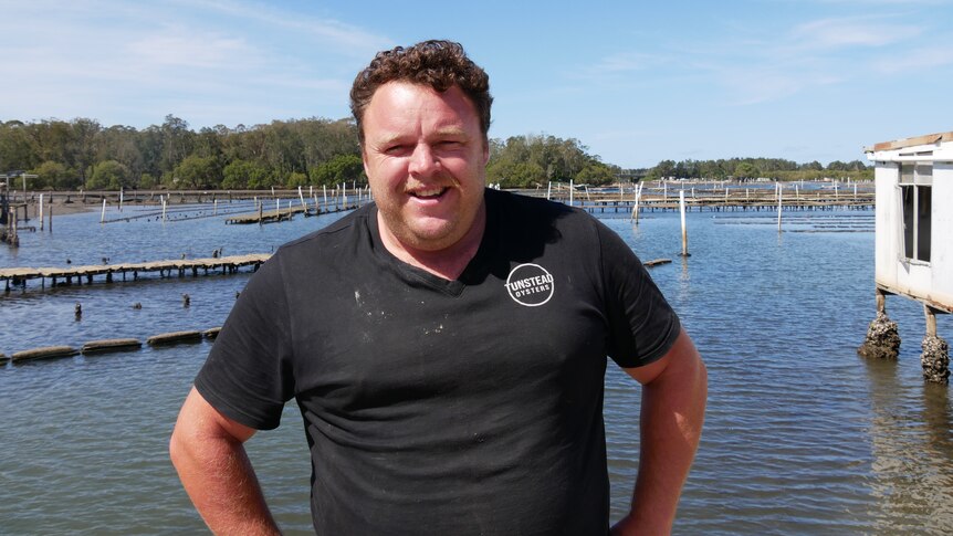 David Tunstead standing in front of the Hastings River with oyster leases in it. 