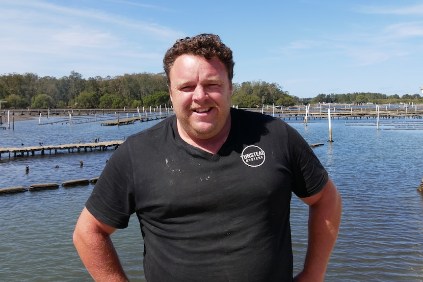 David Tunstead standing in front of the Hastings River with oyster leases in it. 