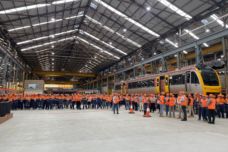 Hundreds of Downer staff gathered in the manufacturing shed