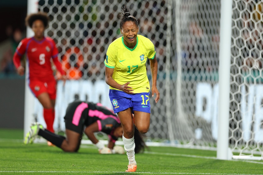 An emotional Brazilian player runs away from goal in celebration after scoring at the Women's World Cup.